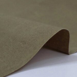 Beige waxed canvas fabric P110 sahara with a finely woven texture.